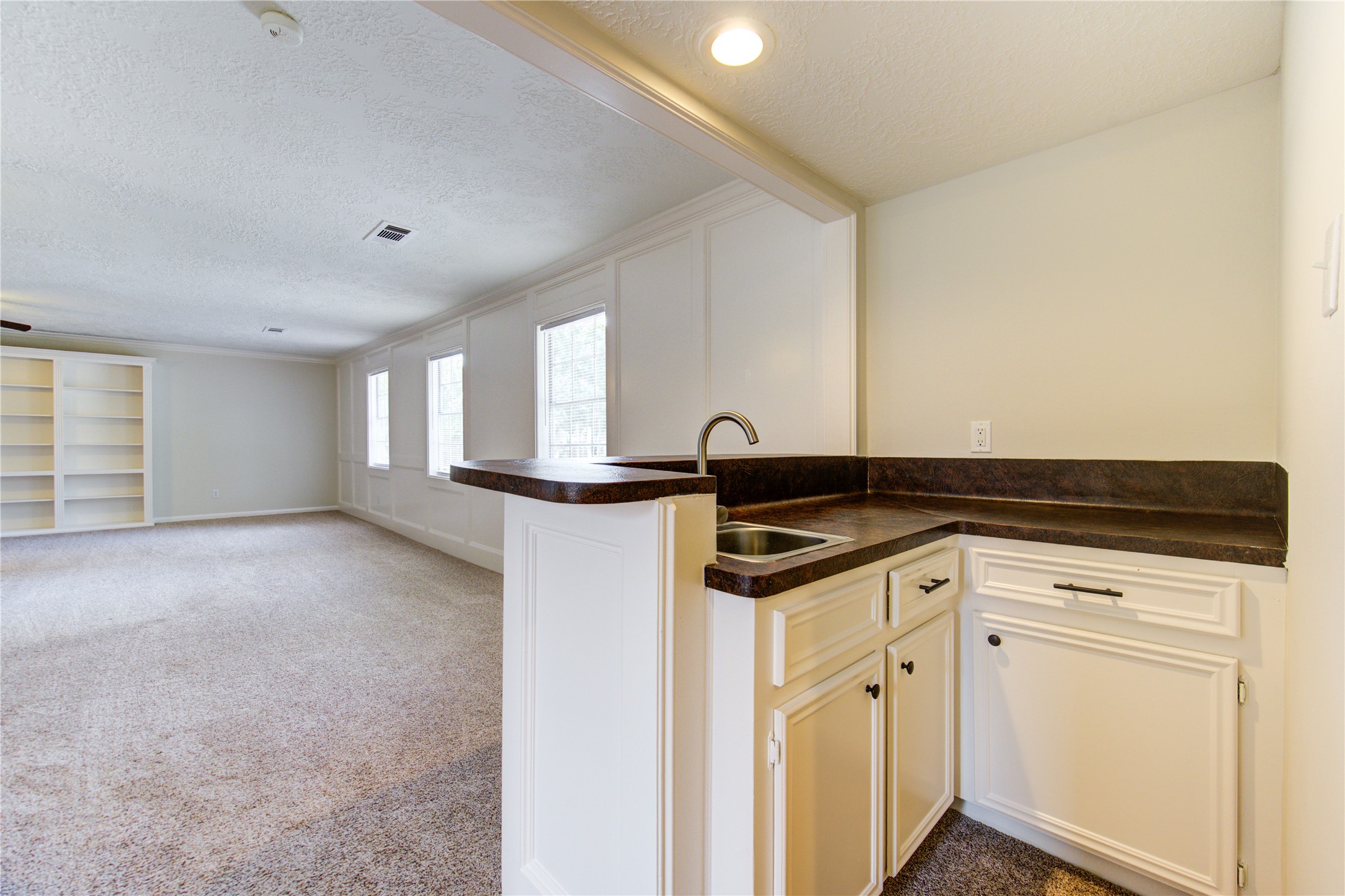 9115 Taidswood Drive Spring, TX 77379 - Photo 33 of 45 This wet bar is located in the game room.