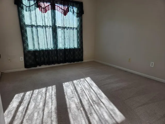 a view of balcony with floor to ceiling window