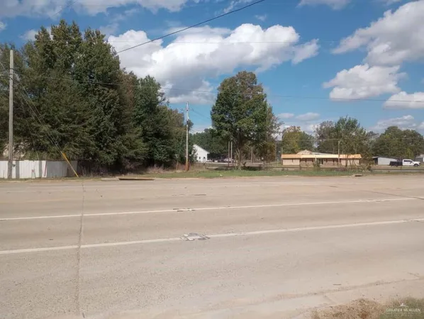 a view of swimming pool and trees in the background