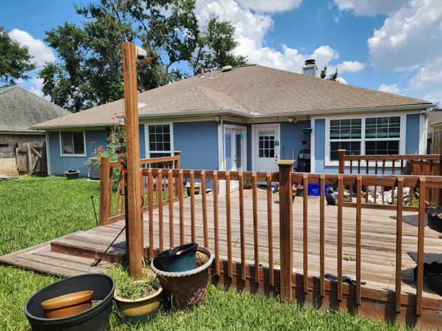 a front view of house with a garden and patio