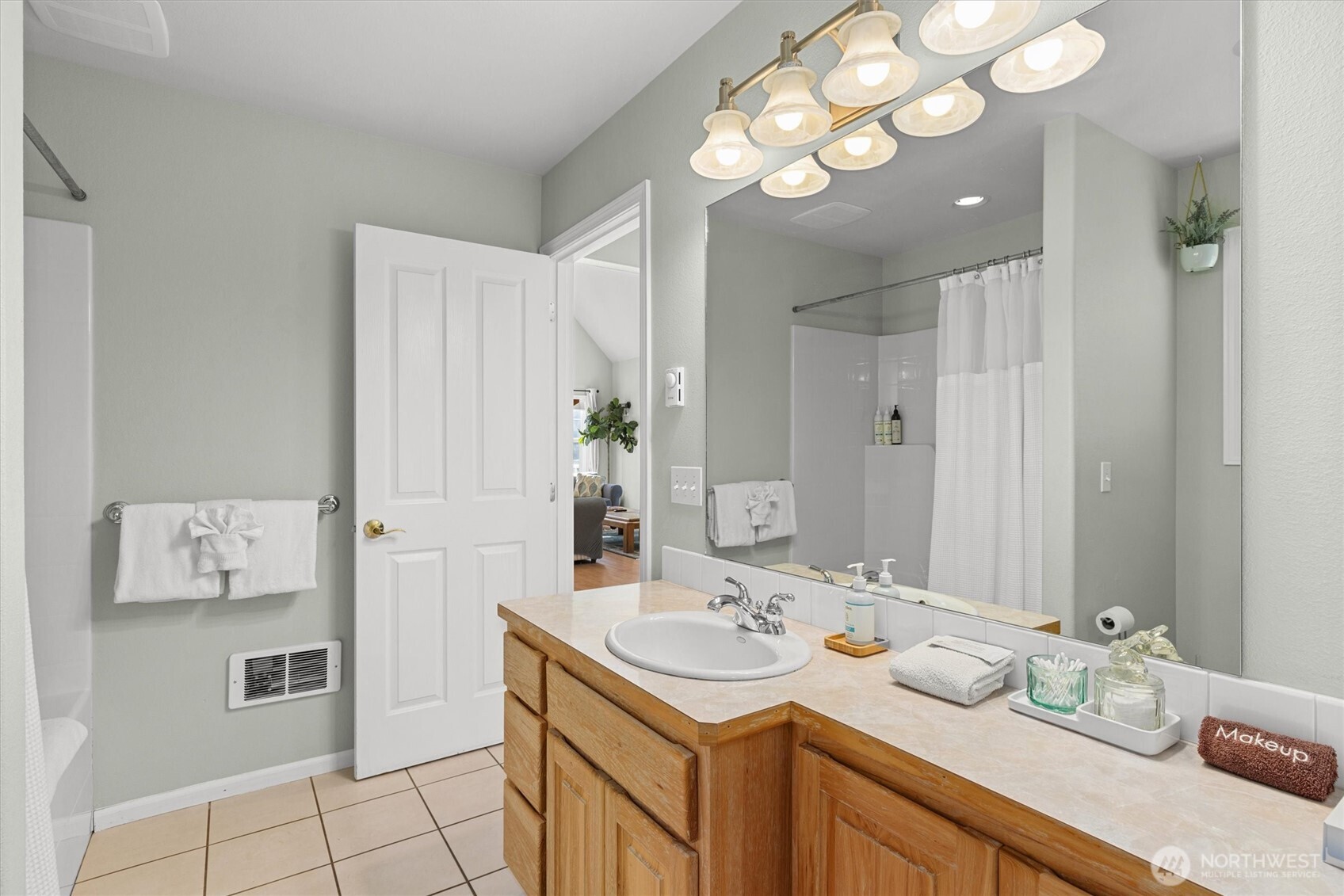 481 Maple Grove Road Port Angeles, WA 98363 - Photo 20 of 40 a bathroom with a sink vanity granite and a mirror
