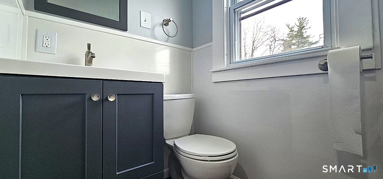 49 Bingham Street Bristol, CT 06010 - Photo 21 of 27 a bathroom with a toilet and a sink