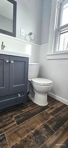a bathroom with a toilet and a sink