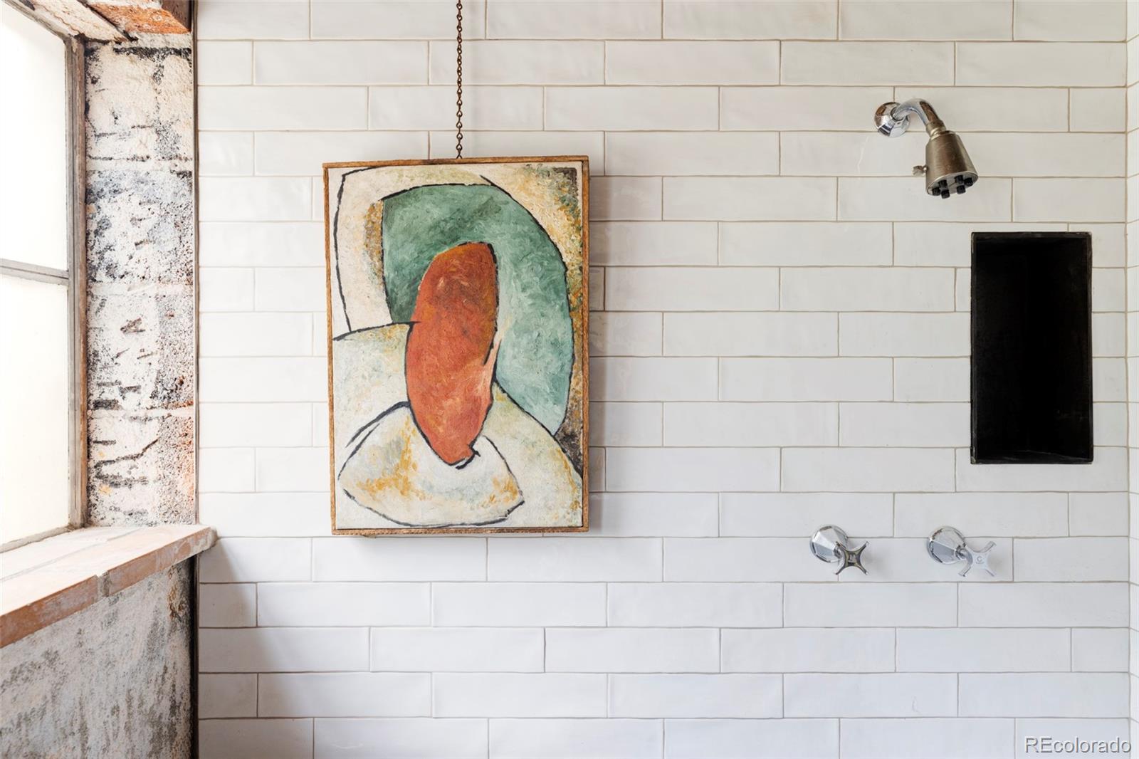 3025 Glencoe Street Denver, CO 80207 - Photo 14 of 26 a bathroom with a sink and a mirror