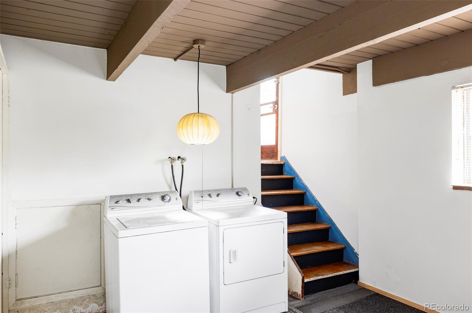 3025 Glencoe Street Denver, CO 80207 - Photo 16 of 26 a utility room with dryer and washer