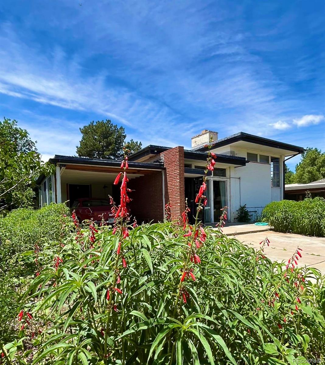 3025 Glencoe Street Denver, CO 80207 - Photo 22 of 26 a view of a car in front of house