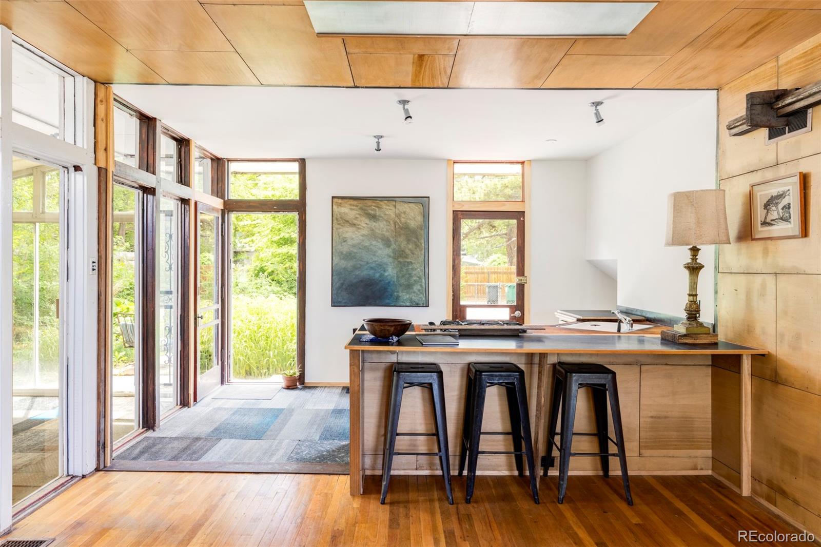 3025 Glencoe Street Denver, CO 80207 - Photo 5 of 26 a view of a kitchen with furniture and window