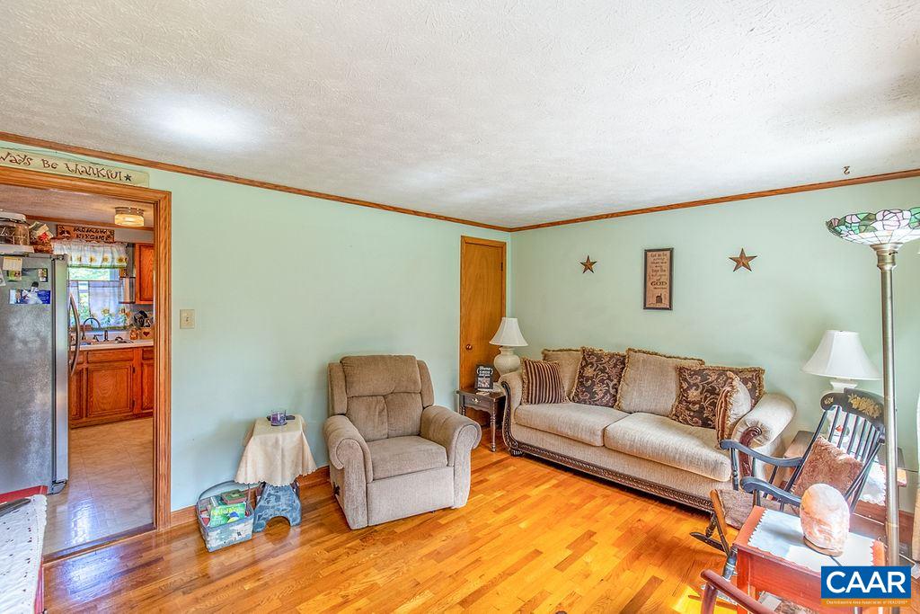 7219 Amicus Road Ruckersville, VA 22968 - Photo 14 of 35 a living room with furniture and wooden floor