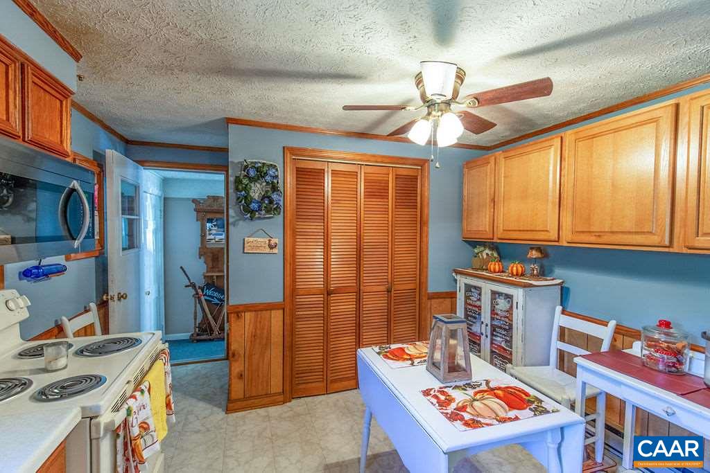 7219 Amicus Road Ruckersville, VA 22968 - Photo 20 of 35 a room with furniture a chandelier and a window