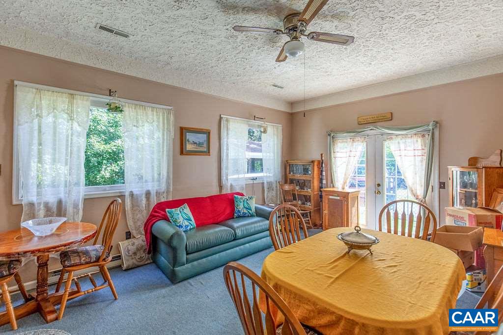 7219 Amicus Road Ruckersville, VA 22968 - Photo 21 of 35 a living room with furniture and a large window