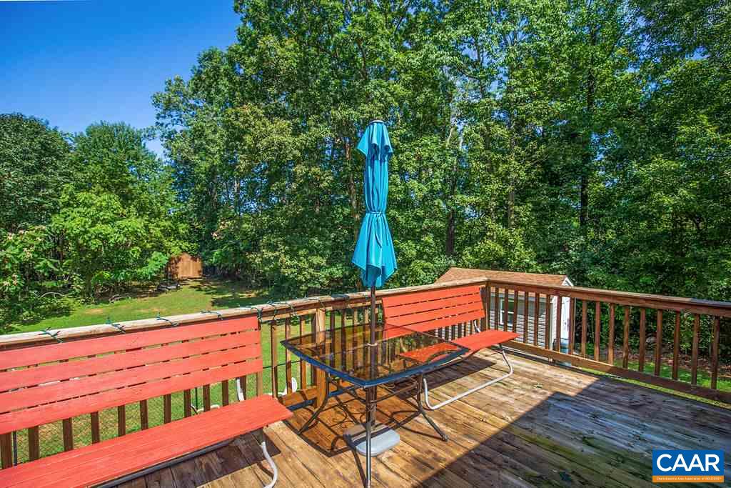 7219 Amicus Road Ruckersville, VA 22968 - Photo 25 of 35 a view of a wooden deck with a yard