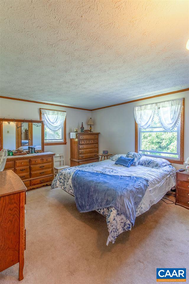 7219 Amicus Road Ruckersville, VA 22968 - Photo 30 of 35 a bedroom with a bed and window