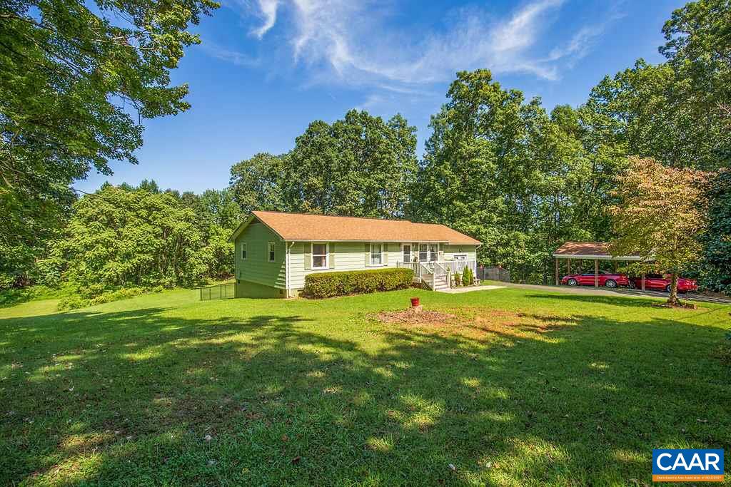 7219 Amicus Road Ruckersville, VA 22968 - Photo 3 of 35 a view of a house with a big yard and large trees