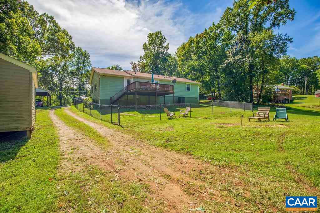 7219 Amicus Road Ruckersville, VA 22968 - Photo 7 of 35 a view of a swimming pool with a bench and trees around