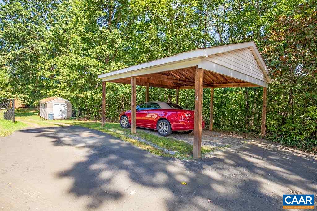 7219 Amicus Road Ruckersville, VA 22968 - Photo 10 of 35 a front view of a house with garden