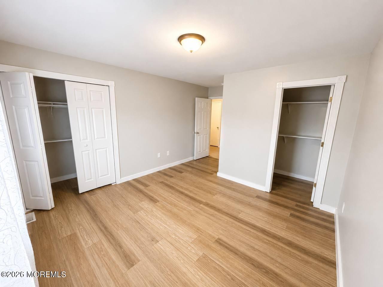 1144 Sawmill Road, Unit 121 Brick, NJ 08724 - Photo 19 of 23 a view of empty room with wooden floor