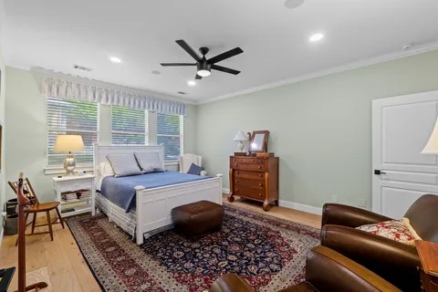 a bedroom with a bed and a couch