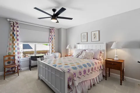 a bedroom with a bed and a table in it