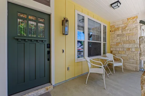 a patio with table and chairs
