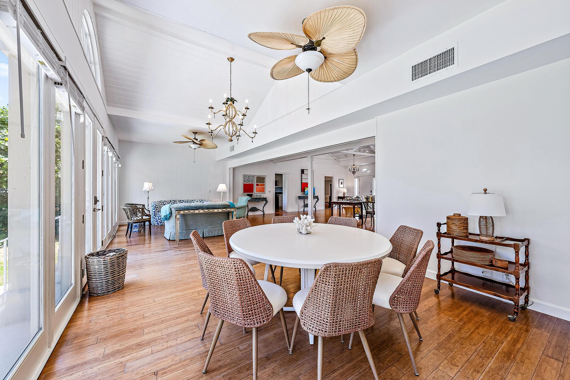 5 North Beach Road Jupiter Island, FL 33455 - Photo 14 of 33 a view of a dining room with furniture and wooden floor