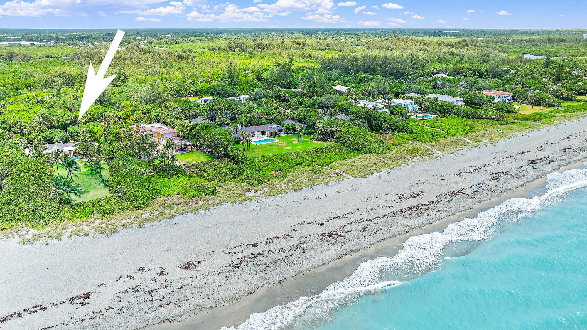 5 North Beach Road Jupiter Island, FL 33455 - Photo 2 of 33 a view of a yard with an outdoor space