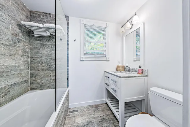 a bathroom with a sink toilet and bathtub