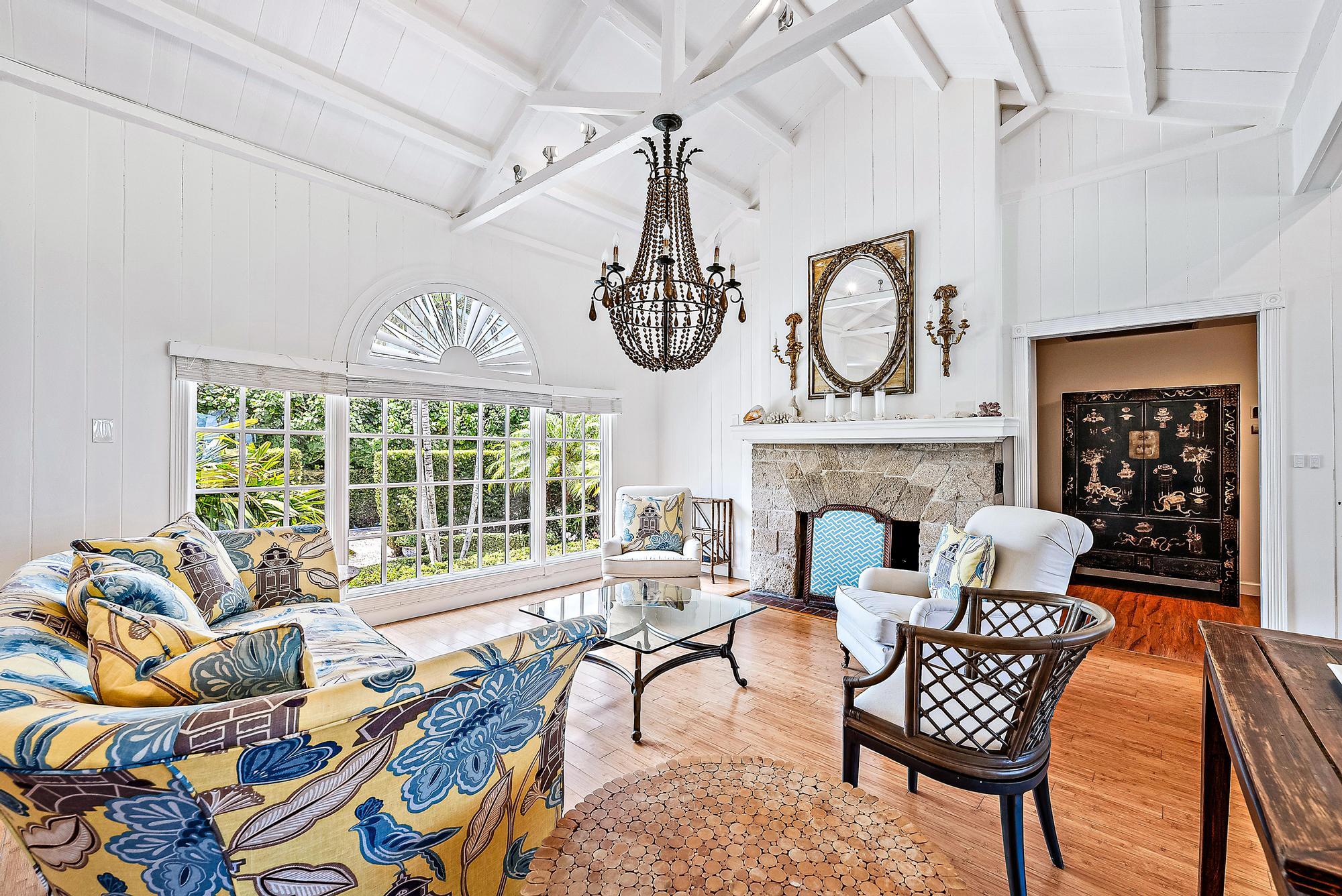 5 North Beach Road Jupiter Island, FL 33455 - Photo 7 of 33 a living room with furniture a fireplace and a chandelier