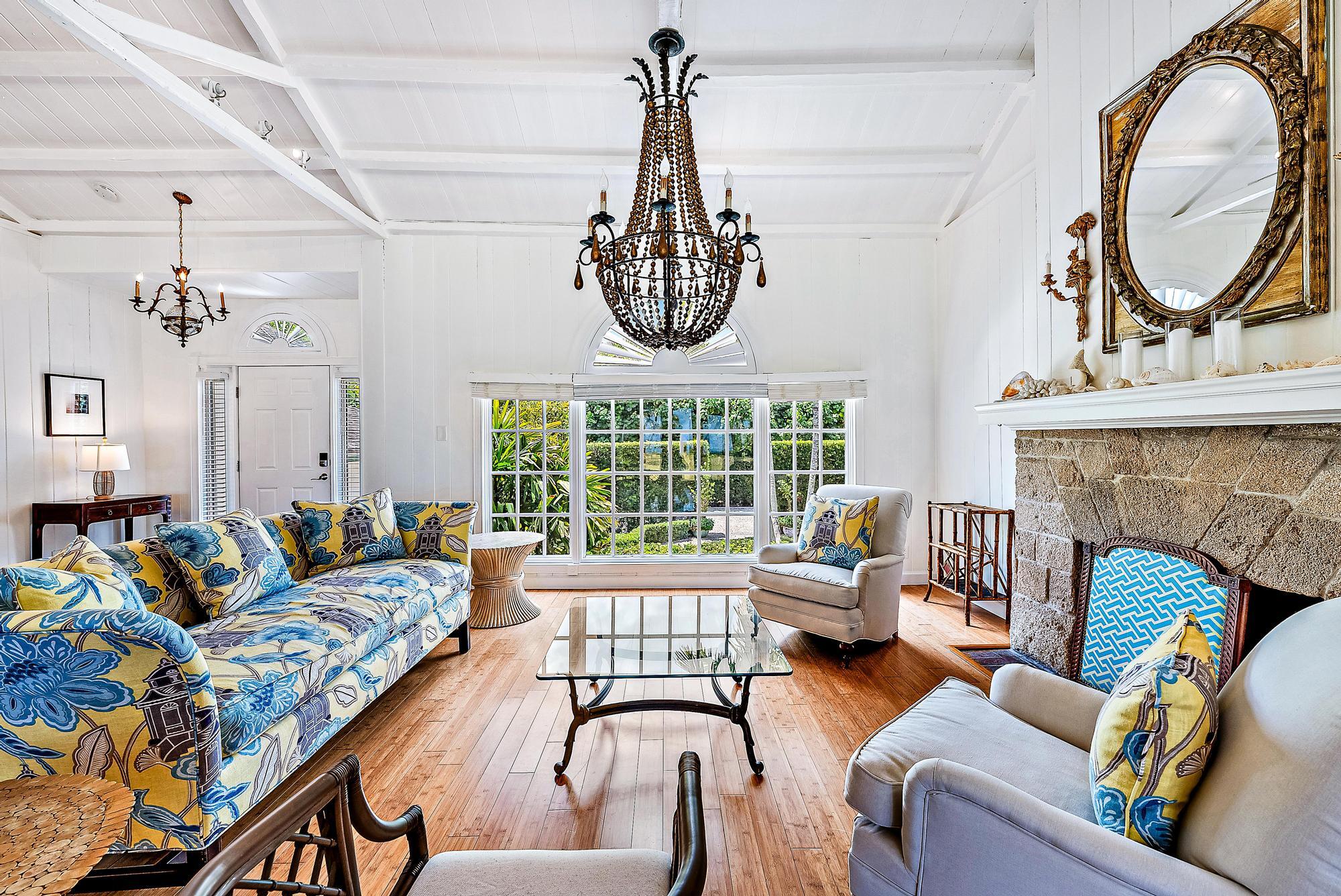 5 North Beach Road Jupiter Island, FL 33455 - Photo 9 of 33 a living room with furniture a fireplace and a chandelier