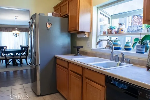 a kitchen with refrigerator and cabinets