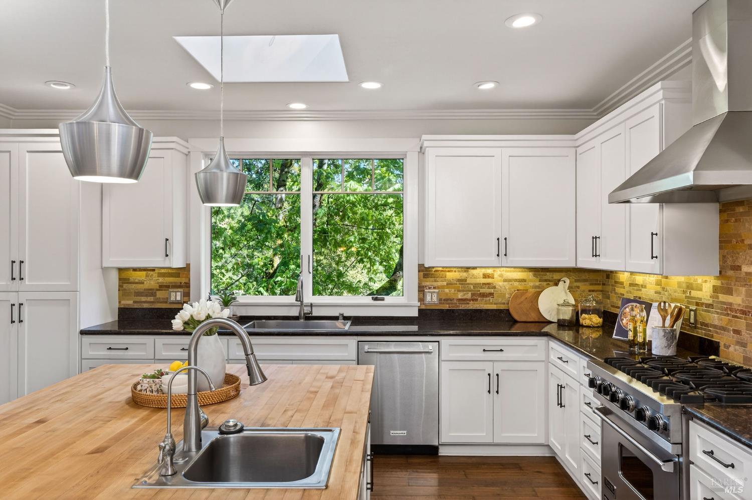 3425 Redwood Road Napa, CA 94558 - Photo 11 of 38 a kitchen with kitchen island granite countertop a sink stainless steel appliances and cabinets