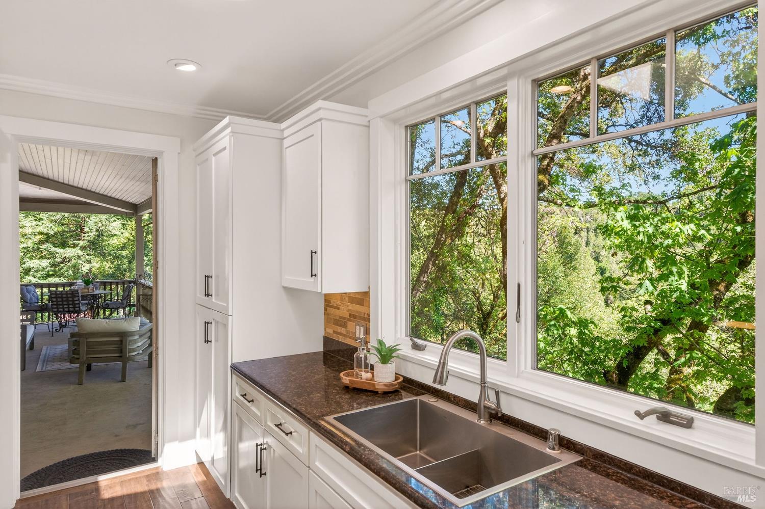 3425 Redwood Road Napa, CA 94558 - Photo 12 of 38 a kitchen with a sink and a large window