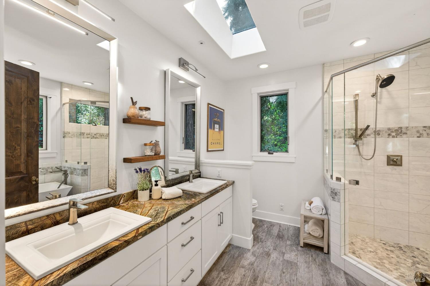 3425 Redwood Road Napa, CA 94558 - Photo 21 of 38 a bathroom with a granite countertop double vanity sink a mirror and a shower