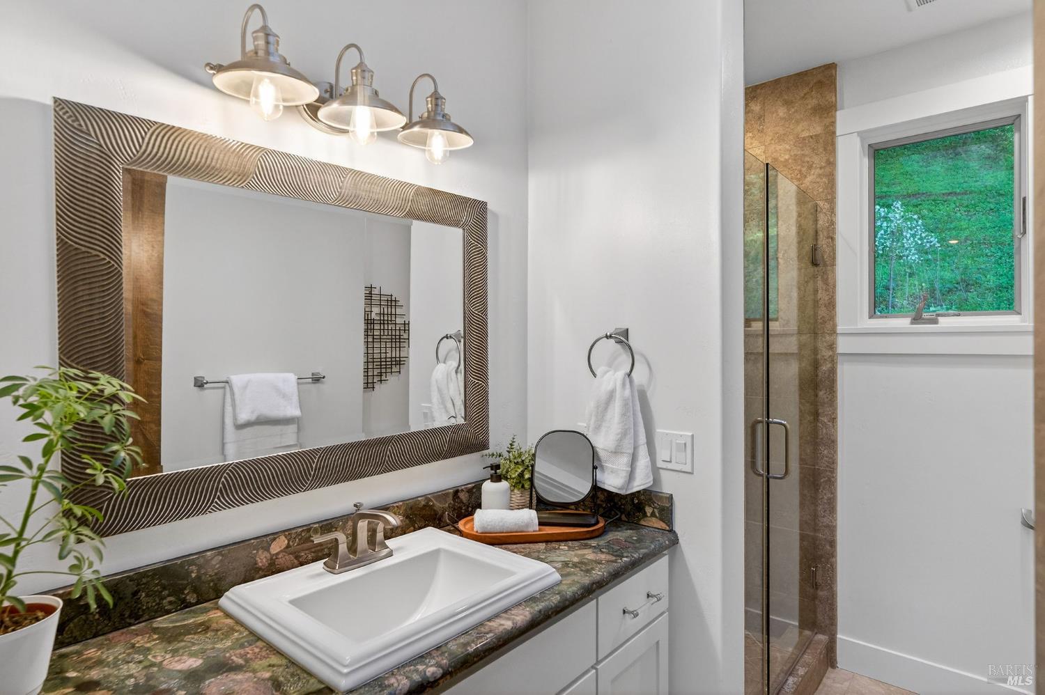3425 Redwood Road Napa, CA 94558 - Photo 27 of 38 a bathroom with a granite countertop sink and a mirror