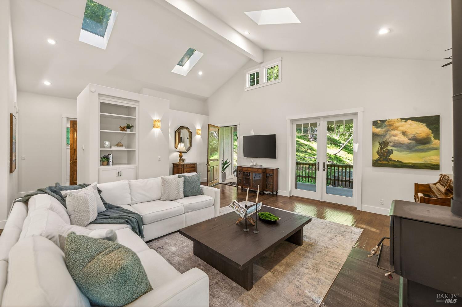 3425 Redwood Road Napa, CA 94558 - Photo 8 of 38 a living room with furniture a flat screen tv and a large window