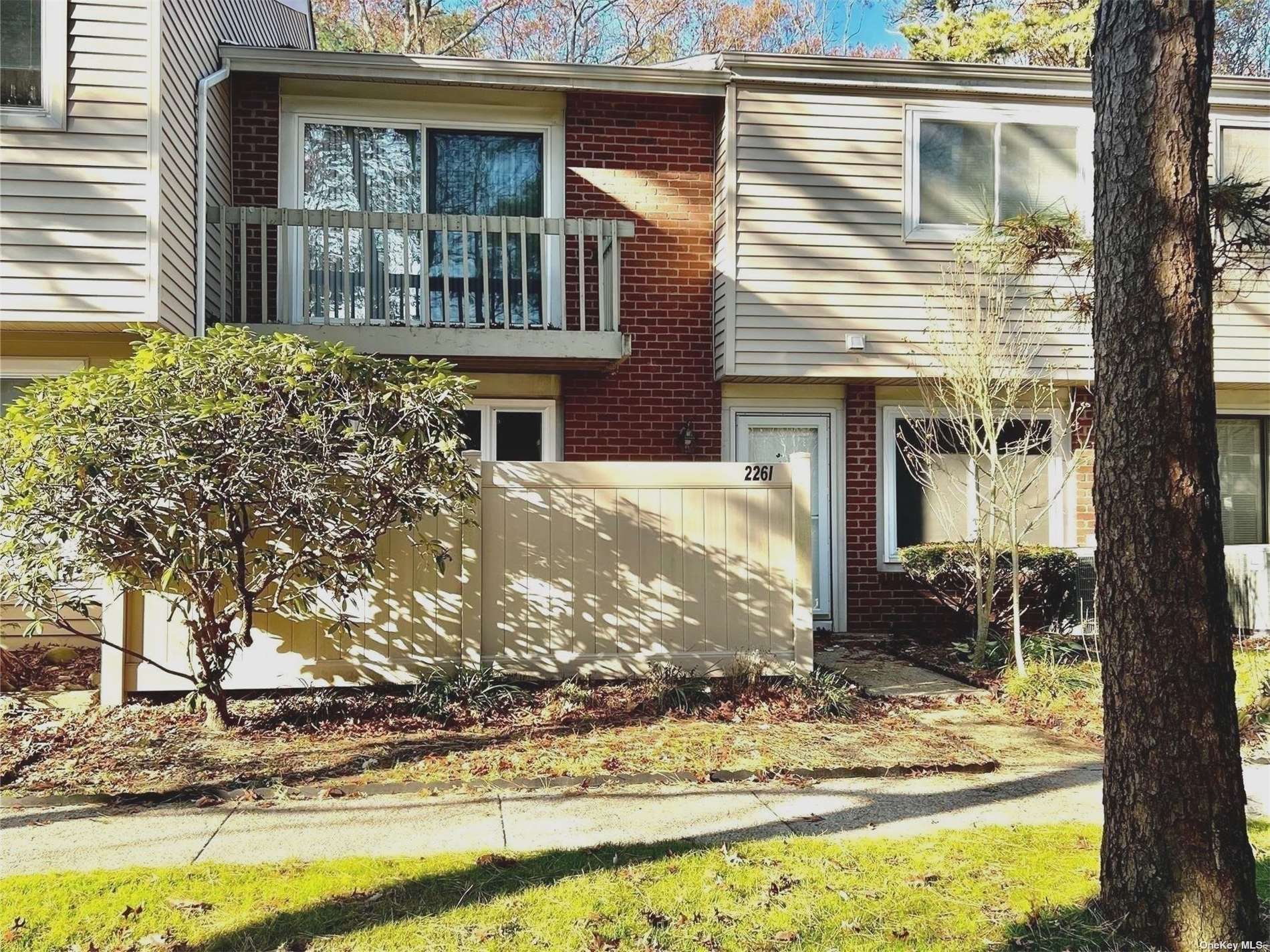 226 Springmeadow Drive, Unit I Holbrook, NY 11741 - Photo 1 of 1 a view of a house with a yard