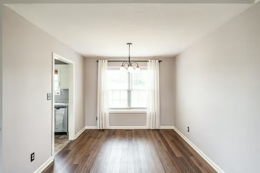 2029 Copper Kettle Circle Pleasant View, TN 37146 - Photo 15 of 58 an empty room with wooden floor and windows