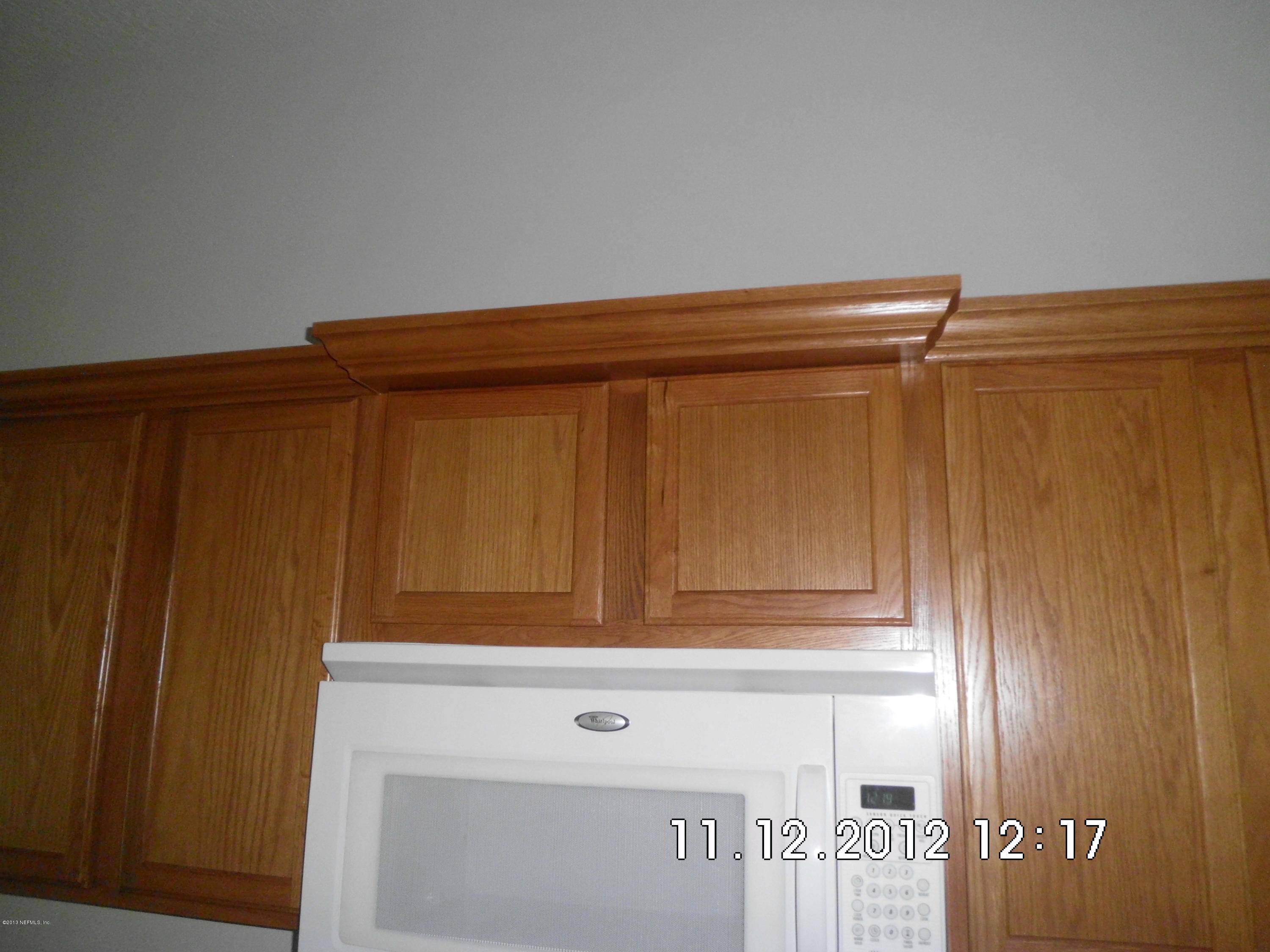 3455 Rustic Oak Trail Middleburg, FL 32068 - Photo 13 of 22 Crown Molding on cabinets
