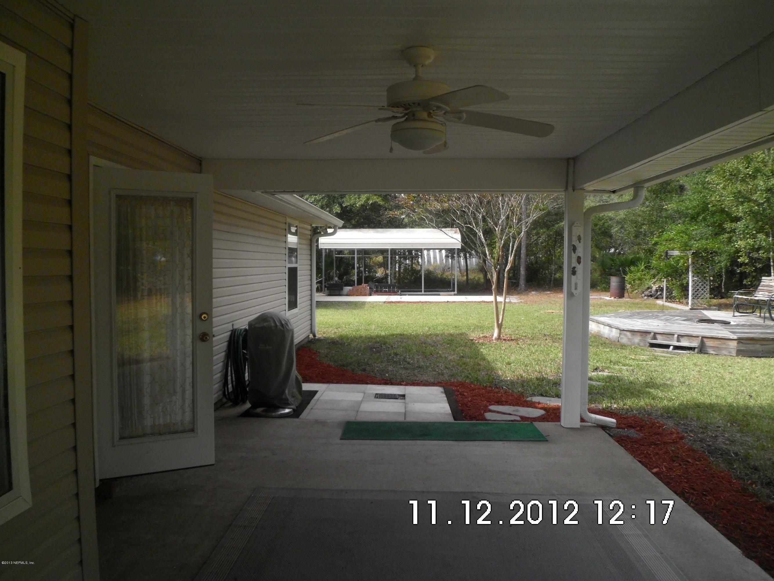 3455 Rustic Oak Trail Middleburg, FL 32068 - Photo 22 of 22 Back yard, covered RV parking.
