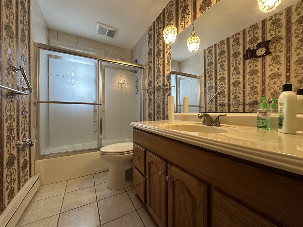 18 Crystal Brook Drive Springfield, MA 01118 - Photo 12 of 20 a bathroom with a granite countertop sink toilet and shower