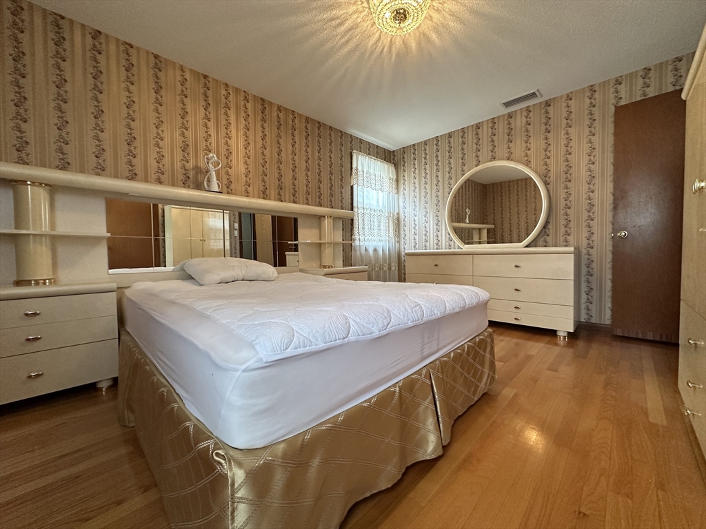 18 Crystal Brook Drive Springfield, MA 01118 - Photo 14 of 20 a bedroom with a bed and a dresser