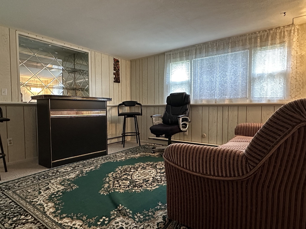 18 Crystal Brook Drive Springfield, MA 01118 - Photo 17 of 20 a view of a livingroom with furniture and windows