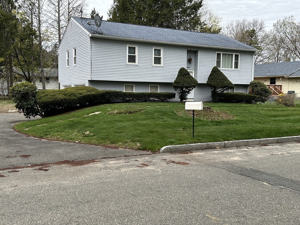 18 Crystal Brook Drive Springfield, MA 01118 - Photo 3 of 20 a front view of house with yard and green space