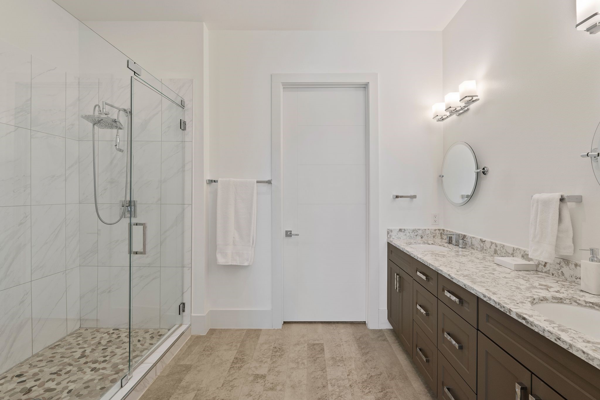 199 Waterpoint Court, Unit 213 Montgomery, TX 77356 - Photo 19 of 46 a bathroom with a granite countertop sink a mirror and a shower