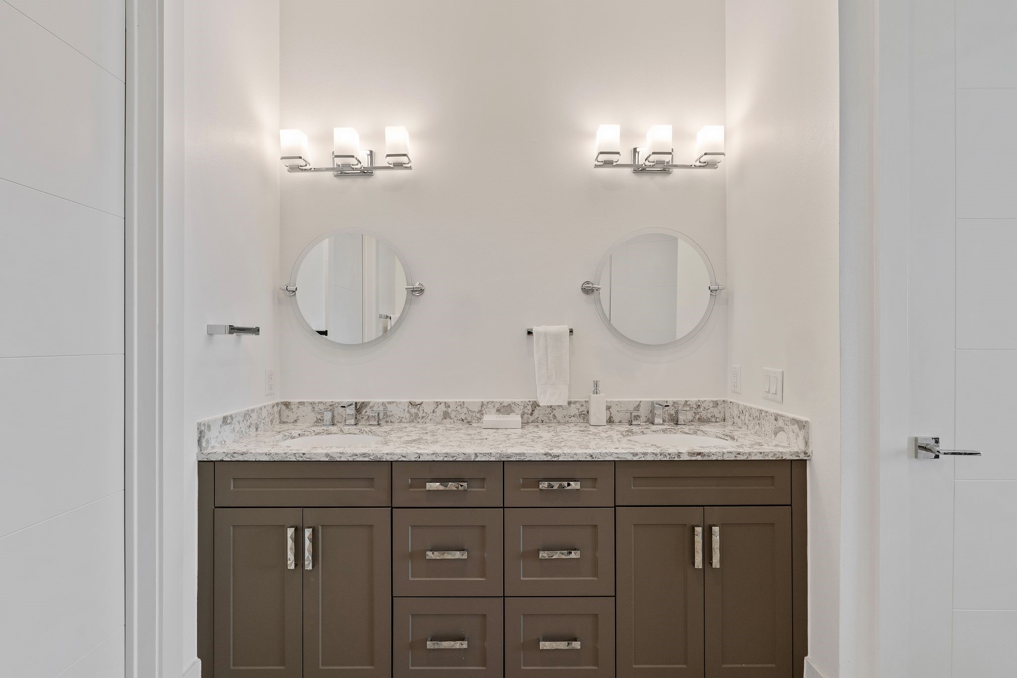 199 Waterpoint Court, Unit 213 Montgomery, TX 77356 - Photo 20 of 46 a bathroom with a double vanity sink and a mirror