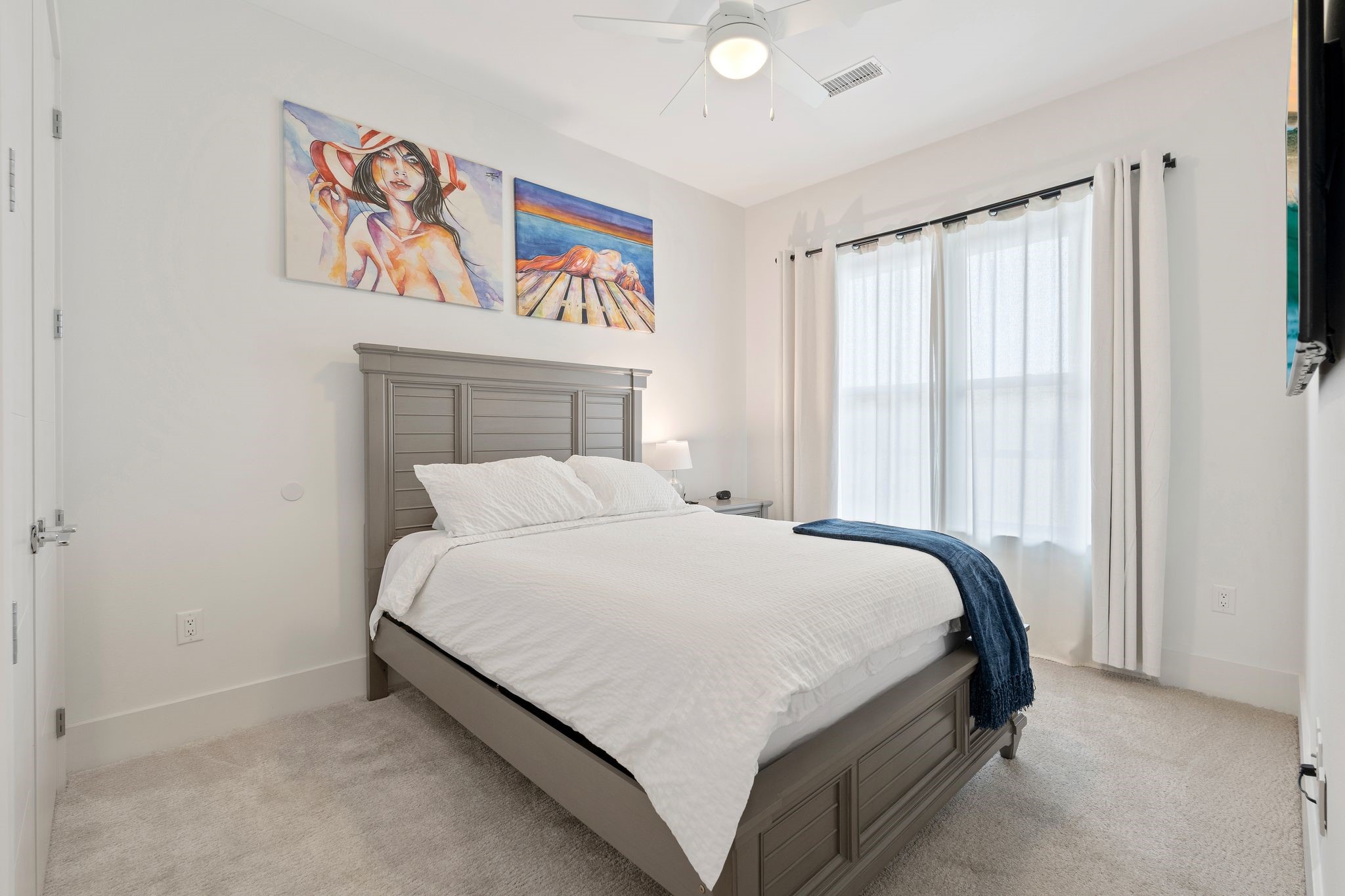 199 Waterpoint Court, Unit 213 Montgomery, TX 77356 - Photo 23 of 46 a bed sitting in a spacious bedroom next to a window