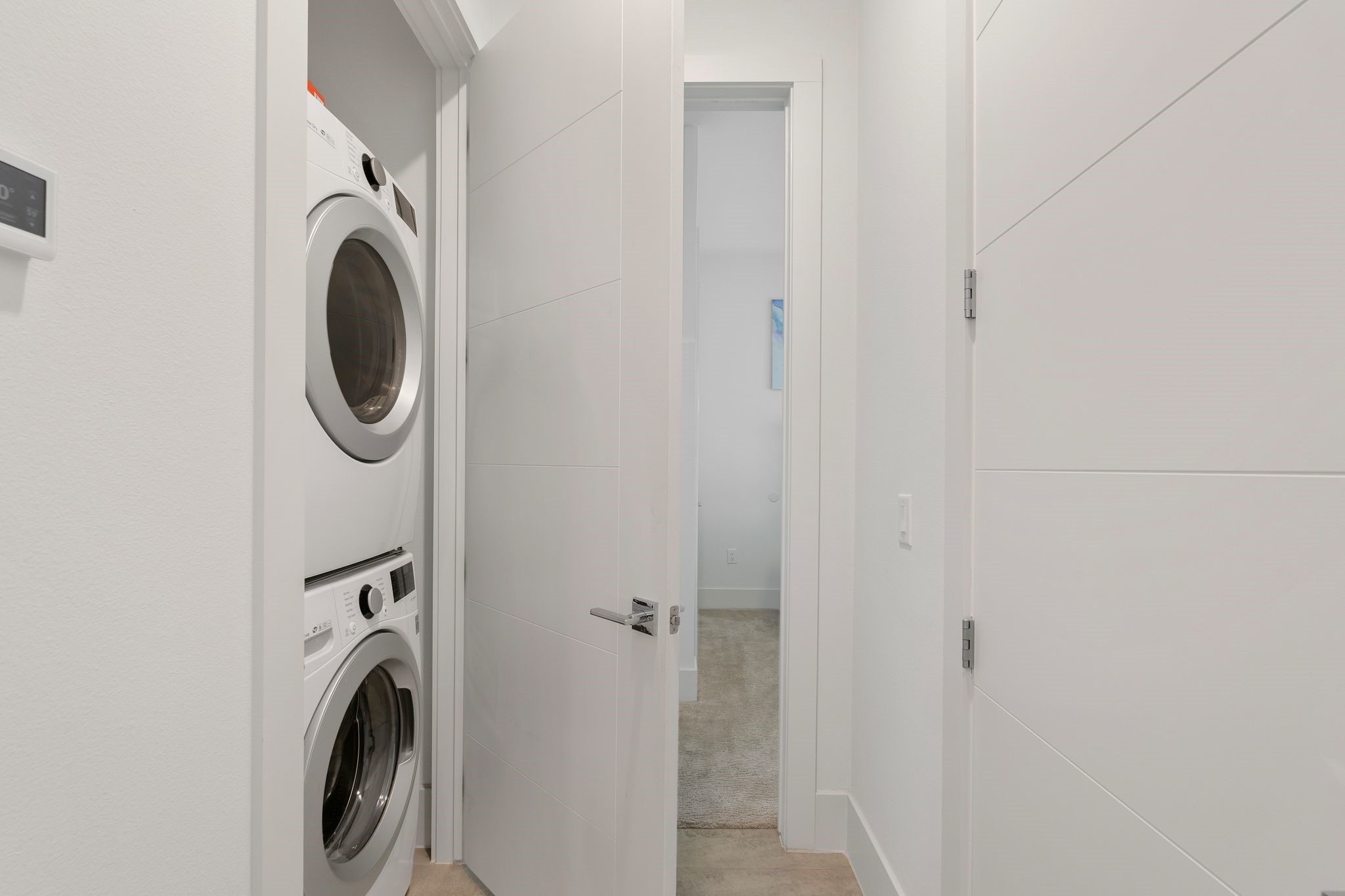 199 Waterpoint Court, Unit 213 Montgomery, TX 77356 - Photo 28 of 46 a utility room with dryer and washer