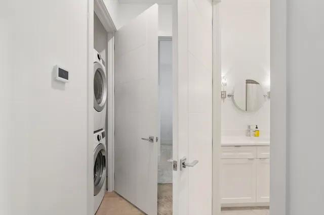 a view of a hallway with paintings on the wall