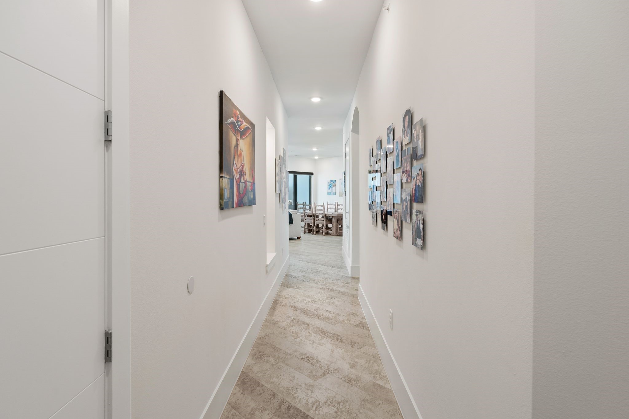 199 Waterpoint Court, Unit 213 Montgomery, TX 77356 - Photo 30 of 46 a view of a hallway with paintings on the wall