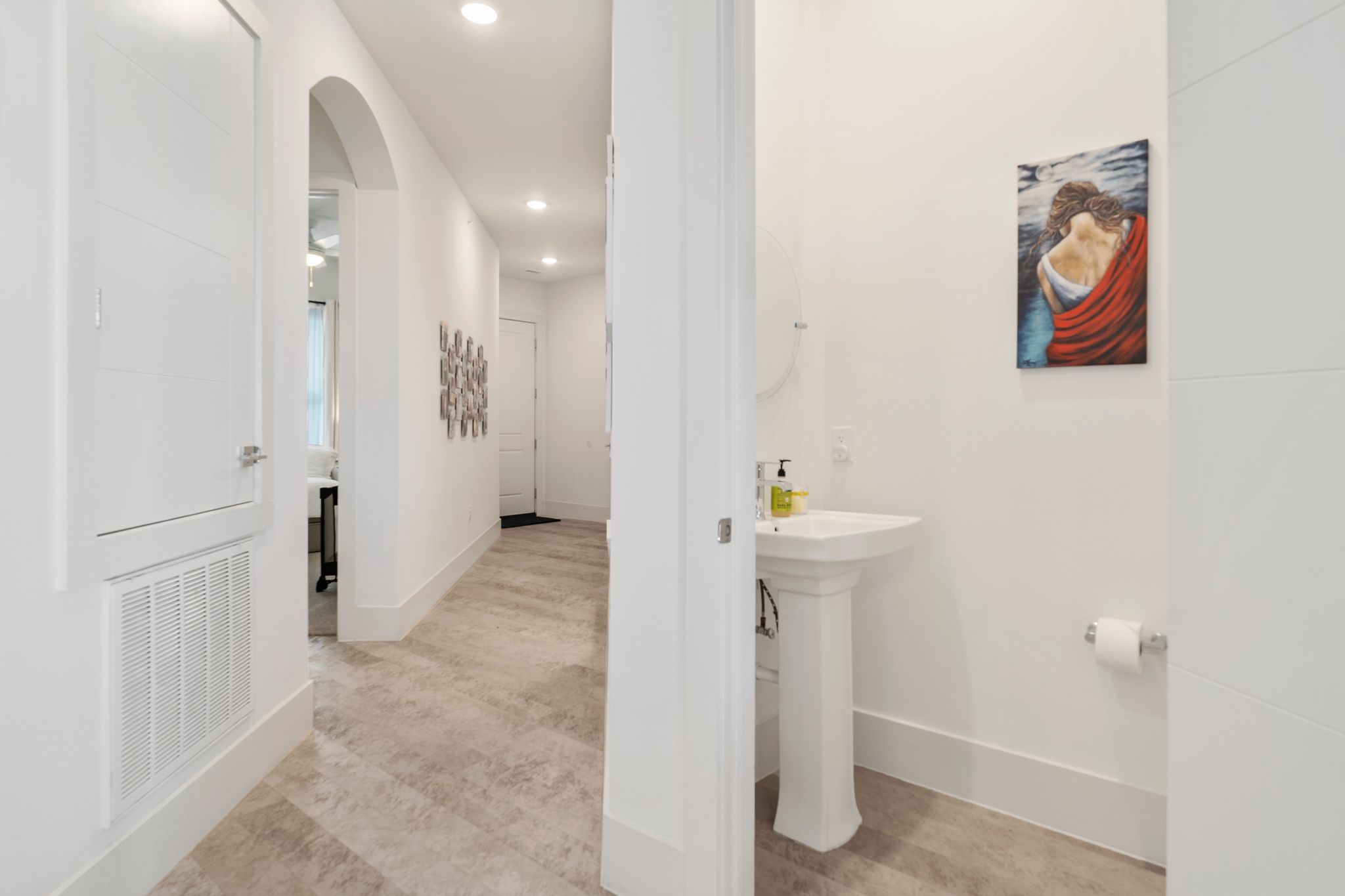 199 Waterpoint Court, Unit 213 Montgomery, TX 77356 - Photo 31 of 46 a view of a hallway with paintings on the wall