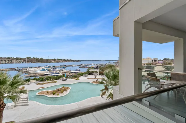 a dining room with furniture and a floor to ceiling window